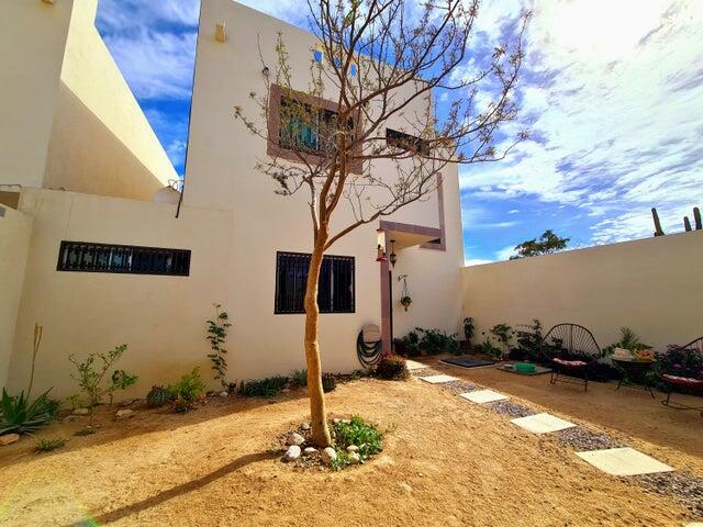 Puerto Los Cabos Csl N-E Of19:Genral GREAT INVESTMENT OPPORTUNITY - ENDLESS POSSIBILITIES!Discover the untapped potential of Casa Altezza, a spacious single-family home nestled in a sought-after residential community in northern Cabo San Lucas, conveniently located off Highway 19 and Tamaral Ave. What sets this property apart? THE LARGEST LOT! in its phase, offering unique development potential! Expand the current home, add residential rental-rooms, design a covered garage, or build the ultimate entertainment space with seamless access--this property's extra land is a blank canvas for creativity and investment. Completed in April 2022, Casa Altezza features 3 bedrooms and 2.5 bathrooms, including an ensuite bath in the master bedroom. The home boasts a spacious front patio with mature plants and trees, along with a private back patio with partial concrete flooring.Several thoughtful upgrades include: - Custom-designed kitchen with a modern, minimalist concept and an expanded window for ample natural light. - Enclosed bonus room for laundry and storage. - High 2.5-meter privacy walls surrounding the property. - Iron-protected doors and windows with installed screens. - Abundant water supply with a total of 23,700 liters, including two cisterns and a rooftop water tank. - New appliances, including a full-size washer & dryer, stove, hood, refrigerator, two inverter mini-splits, and ceiling fans.Casa Altezza sits in an ideal location, just 10 minutes from downtown Cabo San Lucas, Medano Beach, Puerto Paraiso Mall, and The Marina. Daily conveniences like supermarkets, shopping centers, medical facilities, and schools are just minutes away. Plus, the community is a gated neighborhood with electronic access, and a remarkably low HOA monthly fee of only for sale