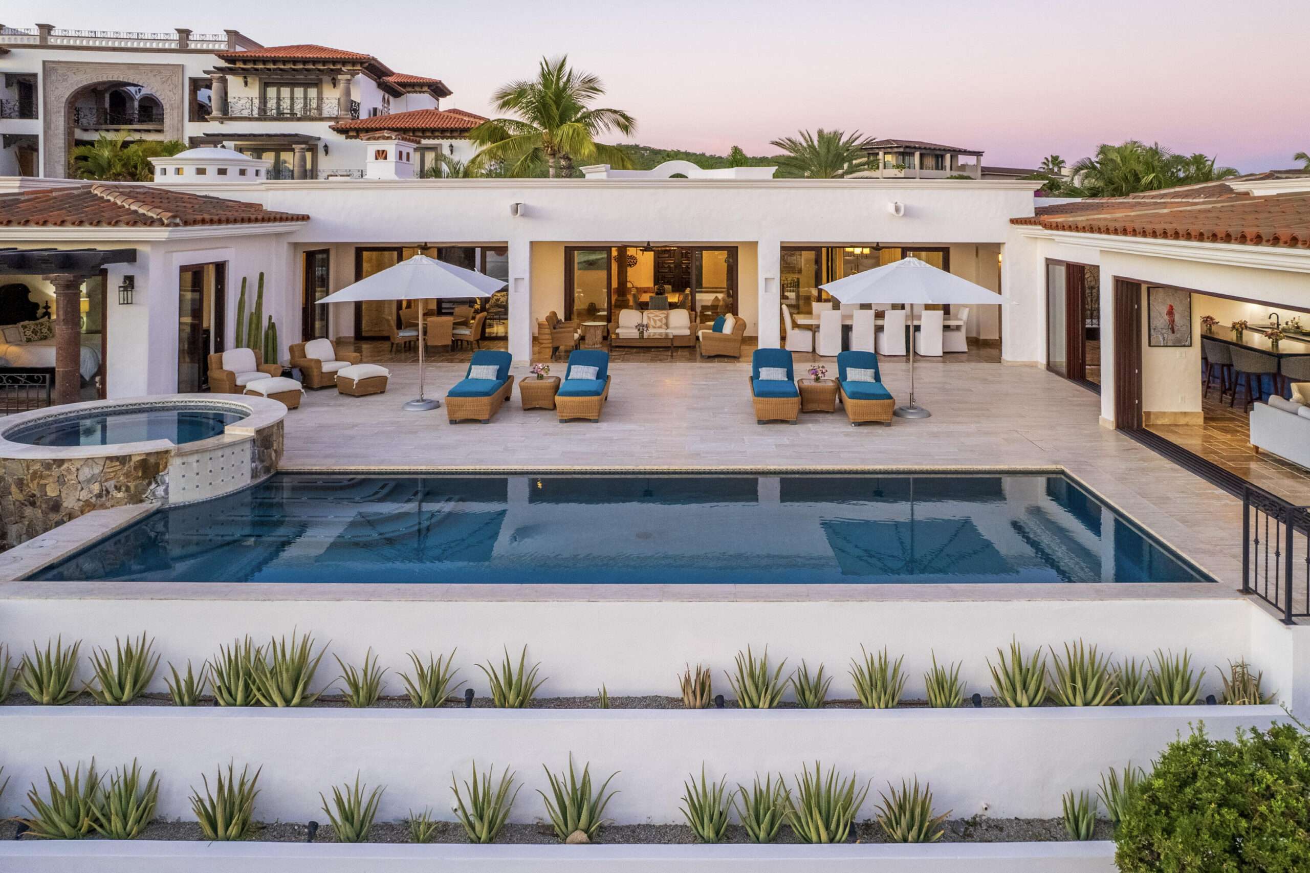 Puerto Los Cabos Fundadores Fully remodeled with entertaining in mind, Casa Reino is a stunning Spanish Colonial-style residence located within the double-gated Fundadores community of Puerto Los Cabos. Designed for hosting extended family and friends while maintaining exceptional privacy, this custom-built home blends timeless architecture with modern luxury and efficiency.An expansive pool terrace invites relaxed lounging under the renowned Los Cabos sunshine, complemented by shaded outdoor living and dining areas and multiple interior courtyards that provide privacy for guest suites. A brand-new bar, media, and entertainment room creates the perfect setting for dinner parties and special events.The thoughtful floor plan features a luxurious master suite with soaking tub and indoor/outdoor shower, along with four private guest suites, each positioned for comfort and seclusion. Modern upgrades throughout the home include all-new plumbing, air conditioning, doors, windows, lighting, and furnishings.Designed for efficiency and convenience, Casa Reino is equipped with a solar system, solar pool heater/chiller, and solar heat pump, keeping operating costs low. Additional highlights include an oversized two-car garage with commercial refrigerator and freezer, a new laundry room with dual washer/dryer sets, and a new BBQ cook center with wet bar, icemaker, and refrigeration. The pool has been newly refinished, exterior travertine decking installed, and a complete hurricane shutter system added.Residents of Puerto Los Cabos enjoy 27 holes of Nicklaus and Norman signature golf, with the option to transfer a golf membership at the purchaser's cost. Membership also includes access to tennis and pickleball courts. Fundadores HOA fees include exclusive access to the Fundadores Beach Club, featuring an oceanfront infinity pool, Jacuzzi, fitness center, event lawn, restaurant, and spa services.Ideally located just 5 minutes from the Puerto Los Cabos Marina, 10 minutes from downtown San José del Cabo, and 30 minutes from Los Cabos International Airport, Casa Reino offers effortless access to world-class dining, shopping, and lifestyle amenities.Special Features & UpgradesSolar system in placeSolar pool heater and chillerNewly remodeled pool with new finishesNew exterior travertine deckingNew bar / media / family roomNew laundry room with double washer & dryersNew air conditioning throughoutNew furnishingsNew kitchen appliances: refrigerator, two dishwashers, ice maker, beverage fridge & drawersNew sinks and faucets in kitchenSonos sound systemNew doors and windowsNew hurricane protection systemNew interior and exterior lightingCommercial refrigerator and freezer in garageNew countertops and cabinetry in kitchenette and bath at Guest Casita #4 for sale